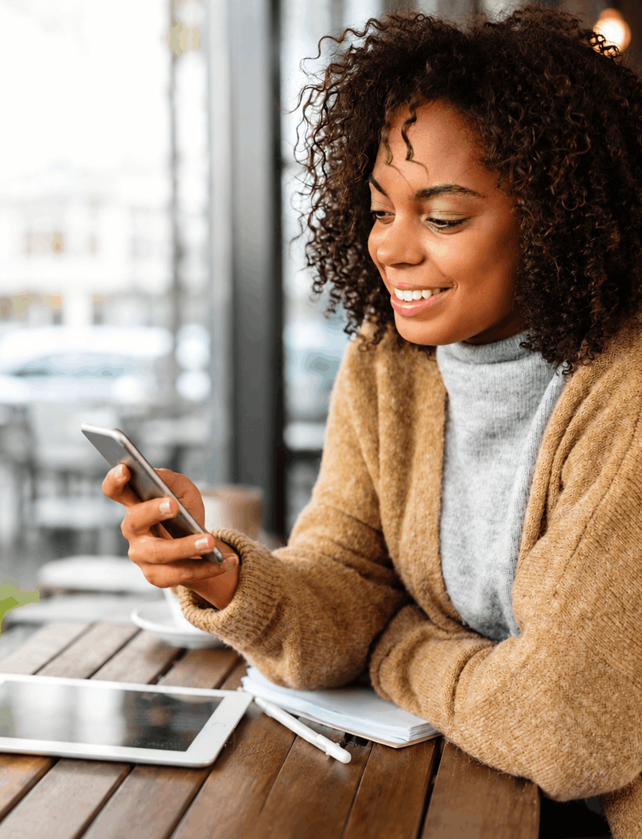 A person getting help on their phone at a café
