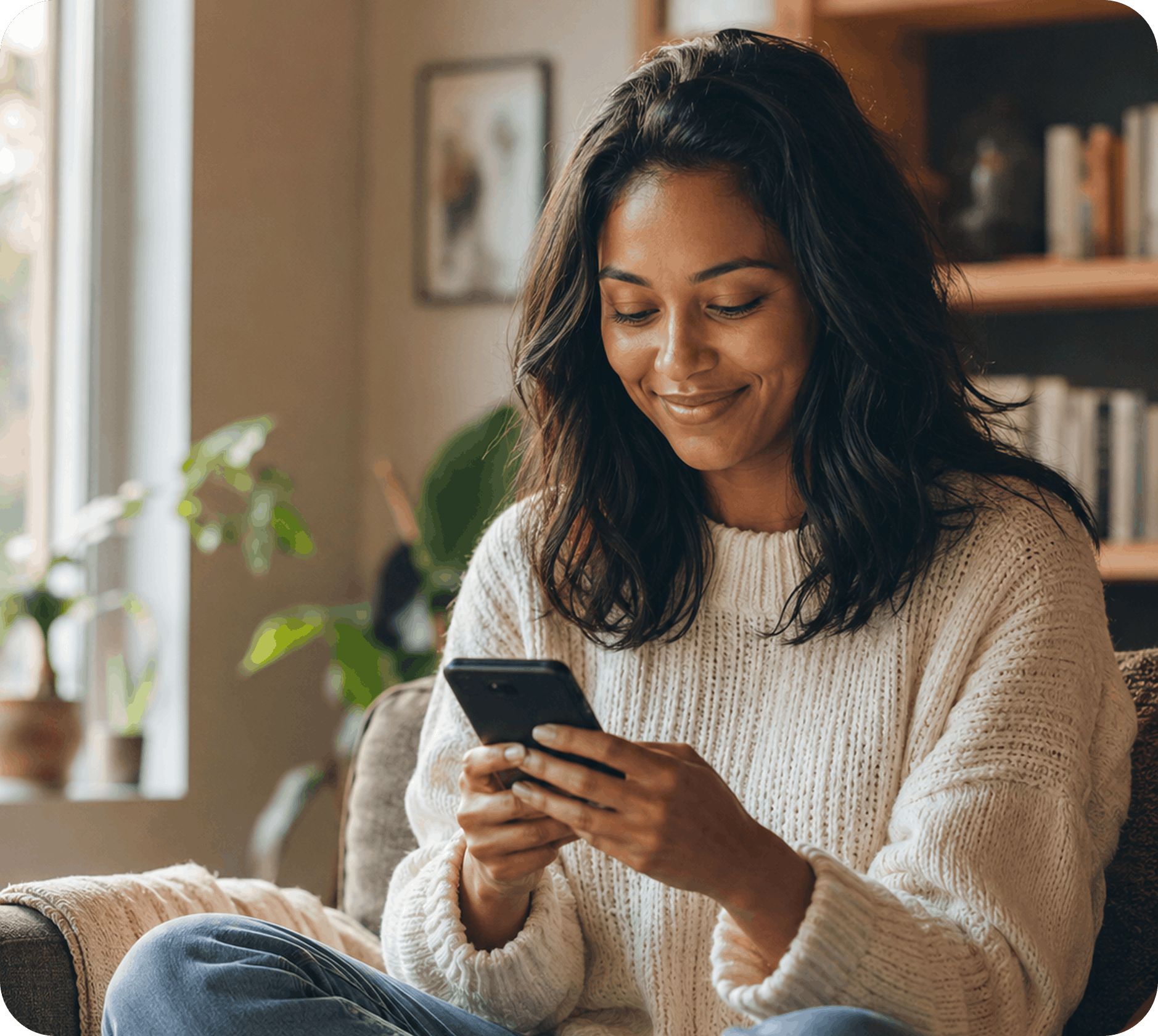 A member checking her phone at home